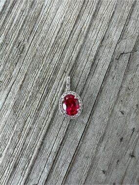 Silver Pendant with Red Oval Gemstone and Halo